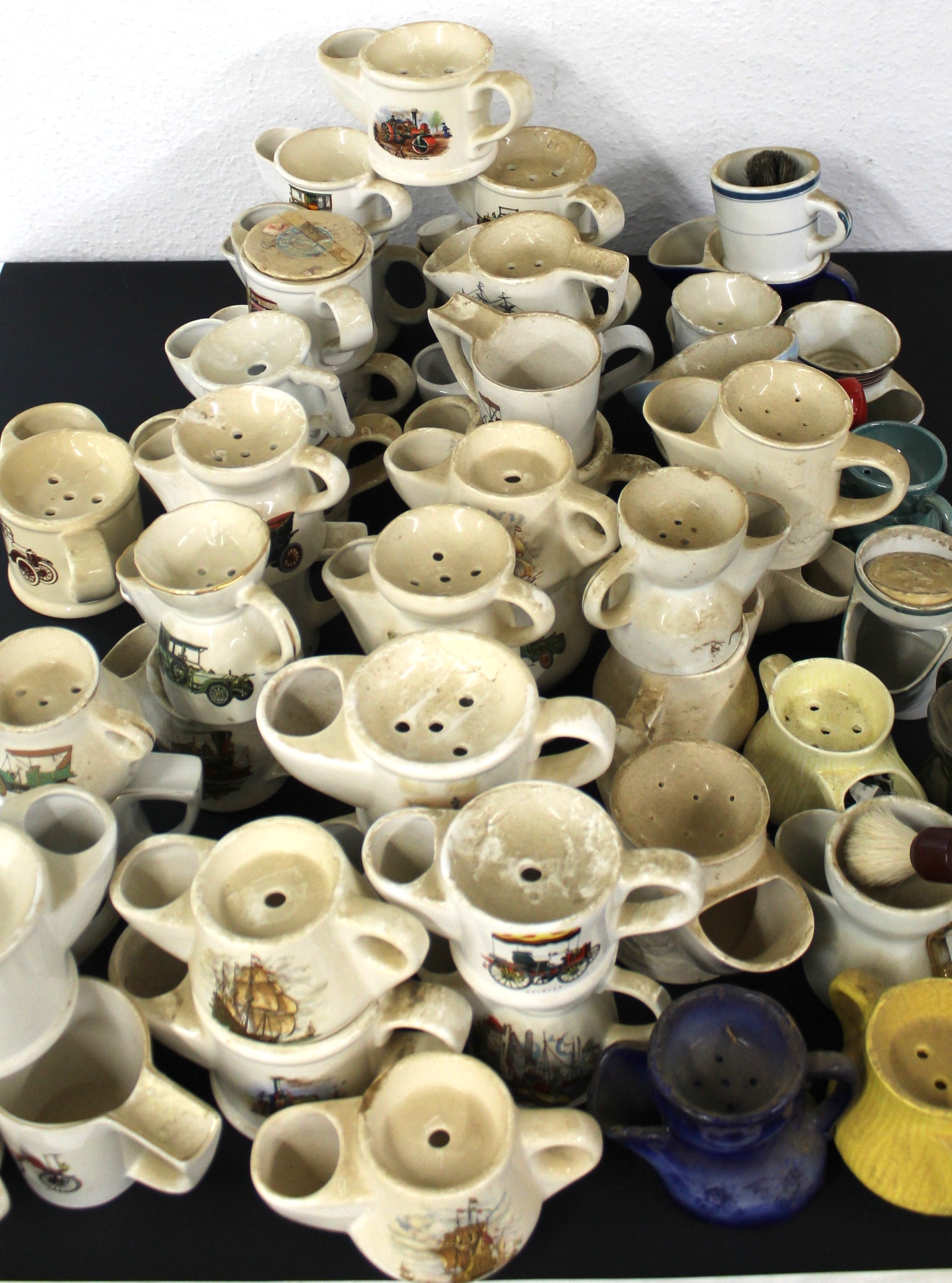 Over 50 Shaving mugs, majority with a transport theme, cars, ships, planes