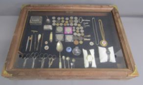 Table top wood and glass display case with key, hinged display slants and contents - includes coins,
