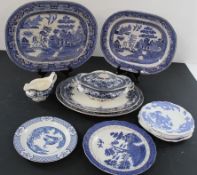 Selection of blue & white meat dishes largest 45cm x 36cm. including Willow pattern Stoneware, and