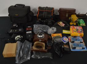Collection of cameras and camera accessories including flashes, lenses, filters, cases and straps
