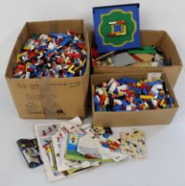 Large amount of Lego in three boxes, including bricks, bases and plans (boxes approx. 49cm x 27cm