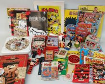 Selection of Beano memorabilia including McDonald's figures, fudge tins, Ertl Gnasher in plane,