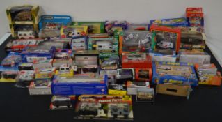 Large selection of boxed diecast cars and toys