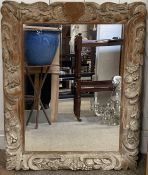 Heavily carved frame wall mirror 86cm by 67cm