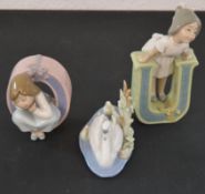 3 Lladro figures in the shape of the letters O and U and a swan (marked C-9, C-15 and 5722)