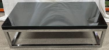 Andrew Martin chrome coffee table with glass cover top 140cm by 80cm Ht 40cm