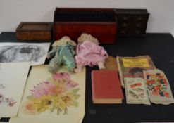 Mahogany courier cabinet, 3 prints, 2 dolls, small chest of drawers, wooden box and books