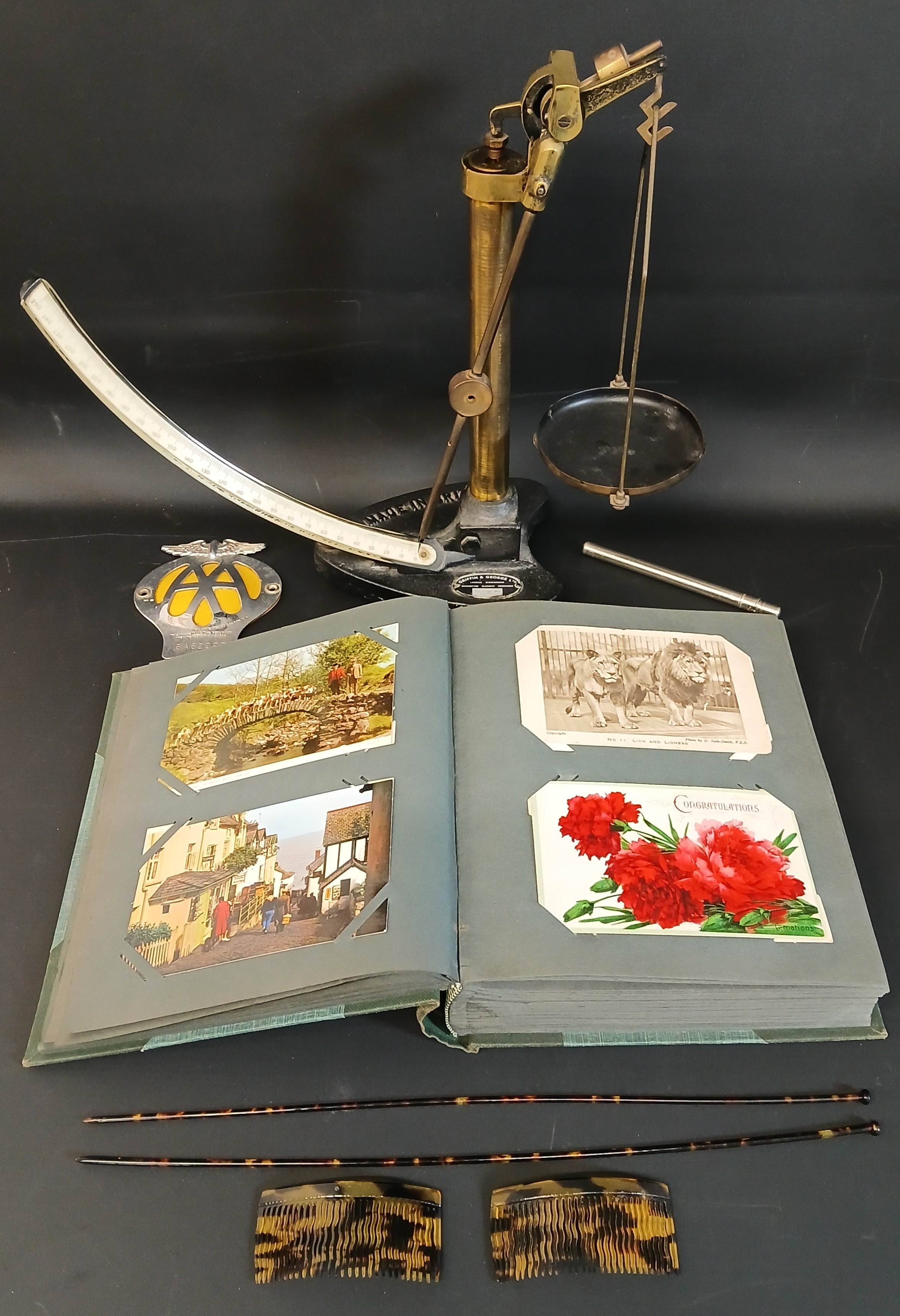 Album of topographical postcards, AA car badge, thermometer, Griffin & George lever arm quadrant