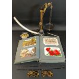 Album of topographical postcards, AA car badge, thermometer, Griffin & George lever arm quadrant