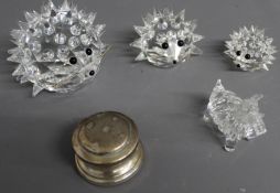 Three various sized Swarovski hedgehogs with metal whiskers and a silver paperweight