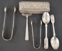Small ornate silver box, silver spoons, food pusher, and tongs. Total weight 7.95 ozt