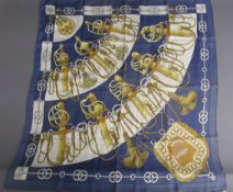 Hermes Cliquetis silk scarf depicting sword handles and tassels in a blue colour, designed by