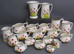 Large number of Crown Ducal poppy pattern jugs