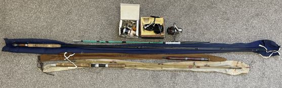 Four vintage fishing rods & three reels