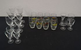 Sets of glasses including 8 with pictures of cars on