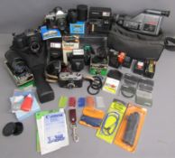 Cameras and Lenses includes - Sanyo VM-D6P camcorder - Polaroid 635CL - Praktica MTL3 - Canon T50