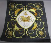 Hermes Springs silk scarf depicting carriages and their wheel springs in black and gold colourway,