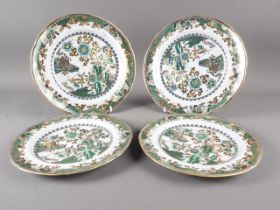 A pair of early 19th century Spode plates with green, black and gilt glazed Chinese garden scene