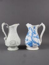 A Ridgway and Abbington vine relief moulded jug, 8" high, and a Botanical relief moulded jug, 8 1/2"