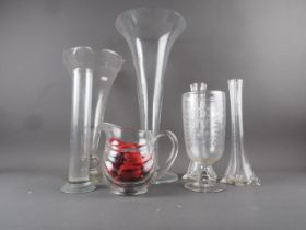 A 19th century celery vase, with engraved star decoration, 9 1/2" high, a clear glass flared rim