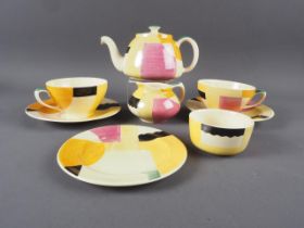A late 1920s Susie Cooper art deco hand-painted afternoon teaset for two (triangle mark)