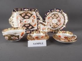 A 19th century Derby Imari pattern teaset for twelve (no teapot)