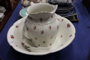 A floral decorated toilet jug and basin set, a Windsor and Newton flagon, a stoneware flagon, an ink