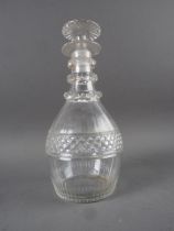 A late Georgian cut glass three ring neck decanter and stopper, 9 1/2" high