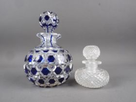An English late 19th century cut glass scent bottle 6 1/2"h, and a smaller scent bottle, 3 1/4"h