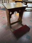 A late 19th century oak prie-dieu or prayer desk in the Gothic style with pierced quatrefoils,