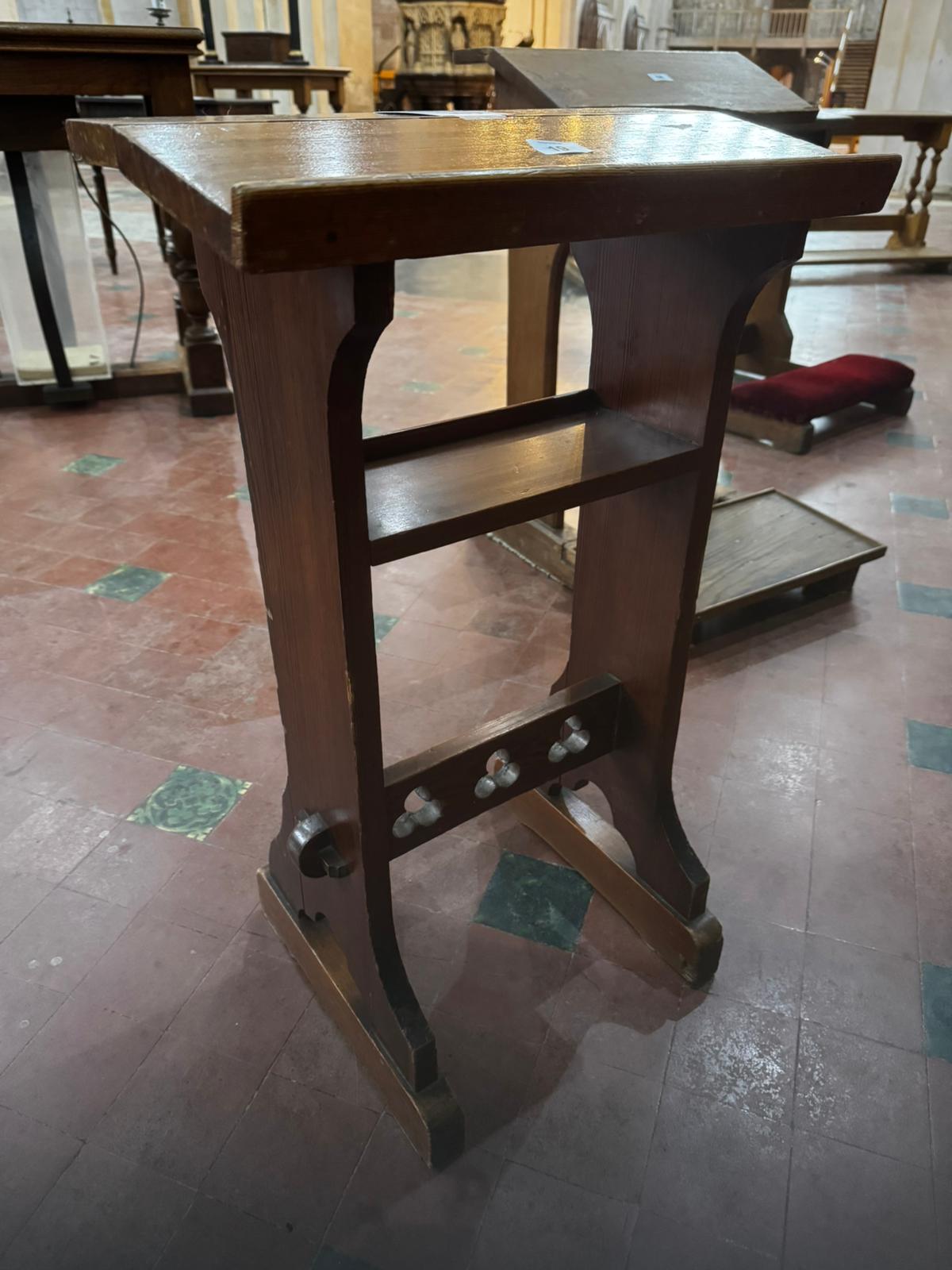 A late 19th century pine prie-dieu or prayer desk of small proportions and having pegged trefoil