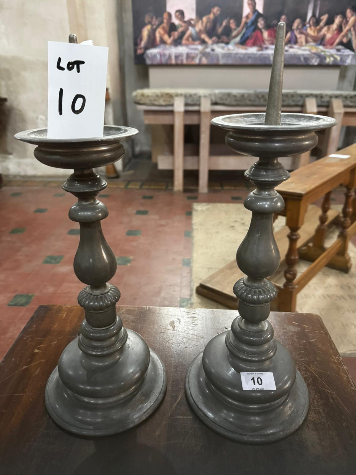 A pair of heavy pewter pricket candlesticks each standing 16.5" (42cm) high.