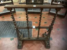 An unusual Continental style barley twist freestanding barrier with blacksmith made scroll supports,