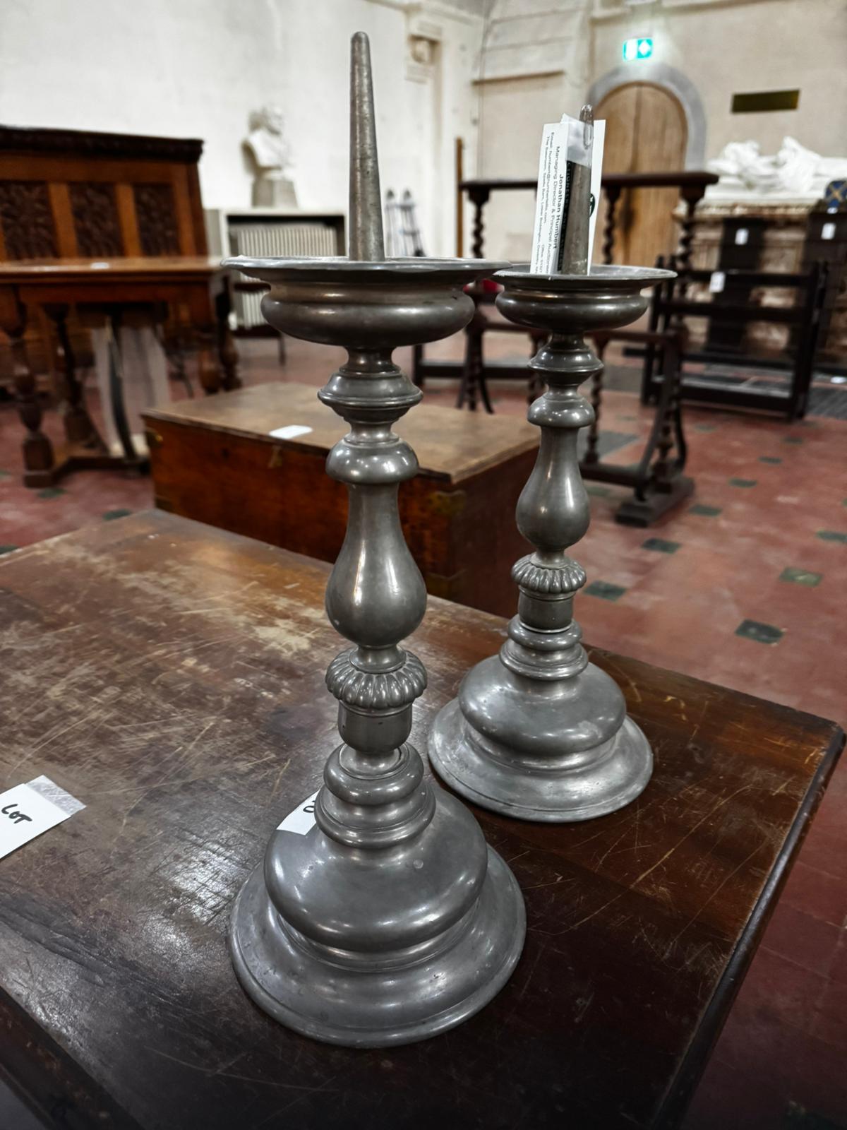 A pair of heavy pewter pricket candlesticks each standing 16.5" (42cm) high. - Image 2 of 3