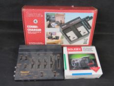 A Hama Combi charger, a CamLink video processor and a camcorder rain-shield, each in box.