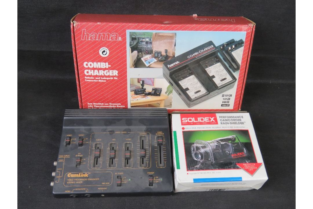 A Hama Combi charger, a CamLink video processor and a camcorder rain-shield, each in box. - Image 1 of 3