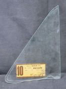 A vintage glass window pane having label 'State of Victoria' for Hill vehicle dated 1968.