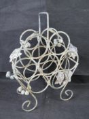 A freestanding wine rack with vine desig
