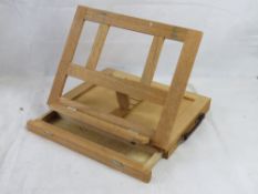 An Artists travelling easel with storage