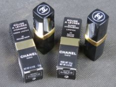 Two Chanel lipsticks in original packaging.