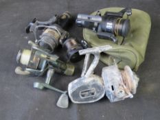 A quantity of assorted fishing reels.