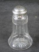 A cut glass and hallmarked silver sugar