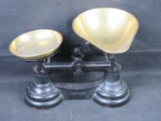 A pair of balance scale with brass trays