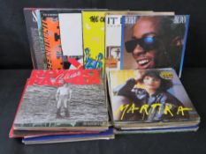 A quantity of assorted vinyl records.