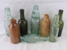 A collection of glass and stoneware bott