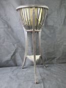 An Edwardian planter stand with liner.