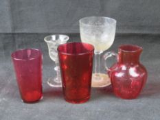 Three items of cranberry glass including
