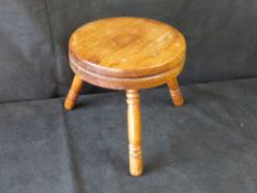 A small pine stool.