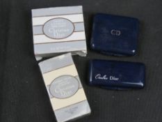 Two Chanel makeup compacts in original packaging.