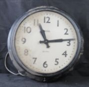 An oversized Smiths Sectric wall clock.